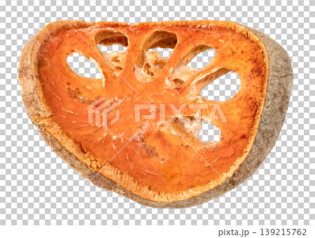 Single slice of dried bael fruit isolated. Aegle marmelos tea ingredient with orange pulp and woody rind. Traditional herbal medicine and healthy beverage concept. 139215762