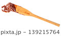 Wooden spatula with a thick smear of dark chocolate cream or hazelnut spread isolated. Professional tool for baking, dessert preparation, and sweet food concept imagery. 139215764