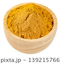 Turmeric powder or yellow curry spice in a small wooden bowl isolated. Natural organic seasoning for cooking and healthy supplements. High quality close-up view. 139215766