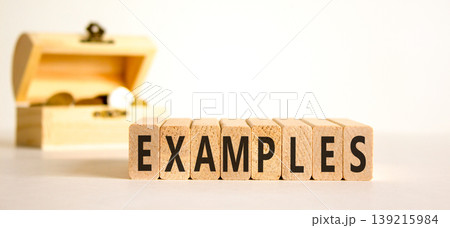Example examples word symbol. Concept word Examples on beautiful wooden blocks. Beautiful white background. Beautiful wooden chest with coins. Business example examples word concept. Copy space. 139215984