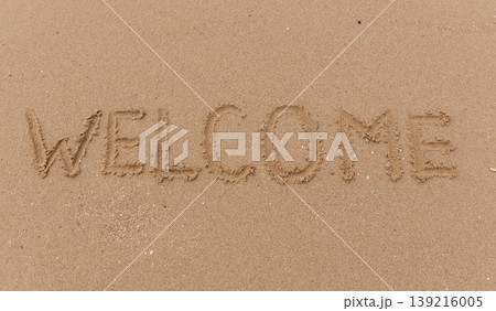 Business hello and welcome concept. Concept word Welcome written on beautiful ocean sea sand beach. Beautiful ocean sand beach background, copy space. Business hello and welcome concept. Business hello and welcome concept. Concept word Welcome written on beautiful ocean sea sand beach. Beautiful ocean sand beach background, copy space. Business hello and welcome concept. 139216005