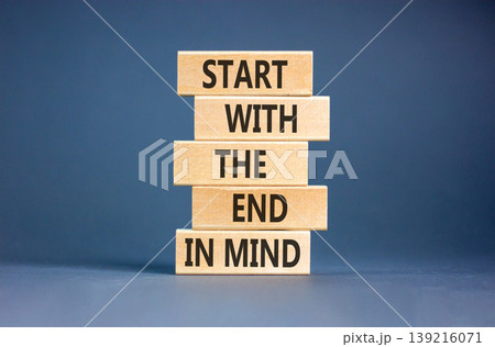 Start with the end in mind symbol. Concept words Start with the end in mind on beautiful wooden blocks. Beautiful grey paper background. Business start with the end in mind concept. Copy space. Start with the end in mind symbol. Concept words Start with the end in mind on beautiful wooden blocks. Beautiful grey paper background. Business start with the end in mind concept. Copy space. 139216071