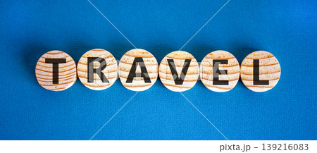 Travel traveling touristic word symbol. Concept word Travel on beautiful wooden circles. Beautiful blue background. Business travel traveling touristic word concept. Copy space. Travel traveling touristic word symbol. Concept word Travel on beautiful wooden circles. Beautiful blue background. Business travel traveling touristic word concept. Copy space. 139216083