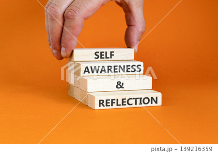 Self awareness and reflection symbol. Concept words Self awareness and reflection on beautiful wooden blocks. Beautiful orange background. Psychological self awareness reflection concept. Copy space. Self awareness and reflection symbol. Concept words Self awareness and reflection on beautiful wooden blocks. Beautiful orange background. Psychological self awareness reflection concept. Copy space. 139216359