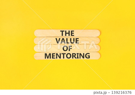 The value of mentoring words symbol. Concept words The value of mentoring on beautiful wooden sticks. Beautiful yellow background. Business the value of mentoring concept. Copy space. The value of mentoring words symbol. Concept words The value of mentoring on beautiful wooden sticks. Beautiful yellow background. Business the value of mentoring concept. Copy space. 139216376