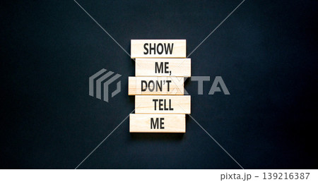 Tell or show symbol. Concept words Show me, do not tell me on beautiful wooden blocks. Beautiful black paper background. Business tell or show concept. Copy space. Tell or show symbol. Concept words Show me, do not tell me on beautiful wooden blocks. Beautiful black paper background. Business tell or show concept. Copy space. 139216387