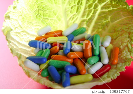 colorful candy on vivid red background colorful candy on vivid red background 139217767