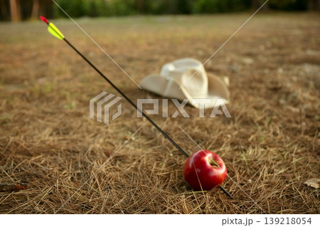 William tell metaphor with red apple and arrow William tell metaphor with red apple and arrow 139218054