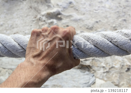 man hand grab grip strong big aged rope 139218117