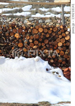 firewood stacked in snow winter outdoor Spain firewood stacked in snow winter outdoor Spain 139218141