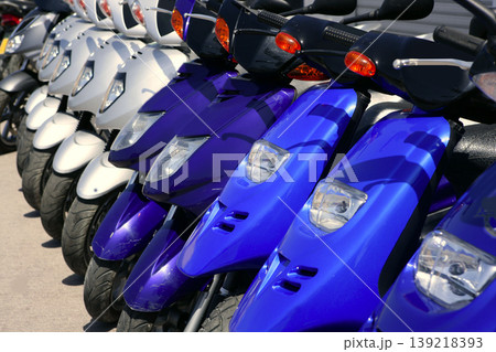 Scooter motorbikes in a row with perspective Scooter motorbikes in a row with perspective 139218393