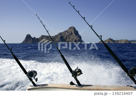 Blue Mediterranean fishing boat rod and reels 139218407