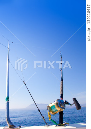 fishing boat trolling with outrigger gear 139218417