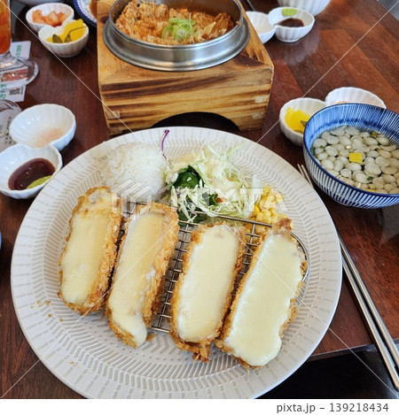 delicious crispy golden fried pork cutlet with melted mozzarella cheese delicious crispy golden fried pork cutlet with melted mozzarella cheese 139218434