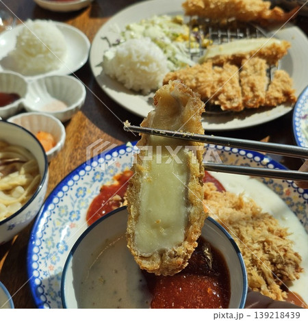 delicious crispy golden fried pork cutlet with melted mozzarella cheese delicious crispy golden fried pork cutlet with melted mozzarella cheese 139218439