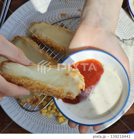 delicious crispy golden fried pork cutlet with melted mozzarella cheese delicious crispy golden fried pork cutlet with melted mozzarella cheese 139218441