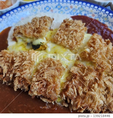 delicious crispy golden fried pork cutlet with melted mozzarella cheese delicious crispy golden fried pork cutlet with melted mozzarella cheese 139218446