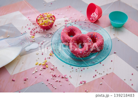 Kids party with milk pink donas and cupcake topings Kids party with milk pink donas and cupcake topings 139218483
