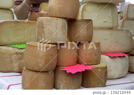 Aged french cheese wheels stacked Aged french cheese wheels stacked 139218544