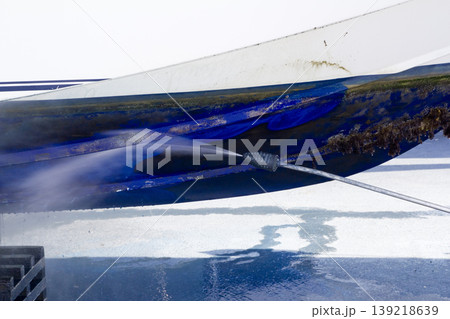 blue boat hull cleaning pressure washer barnacles blue boat hull cleaning pressure washer barnacles 139218639