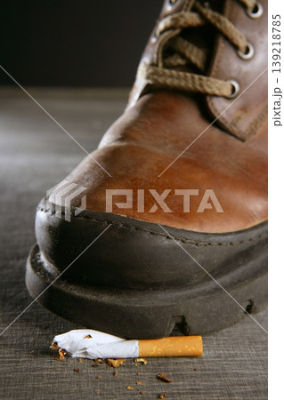 broken cigarette tread by a boot broken cigarette tread by a boot 139218785
