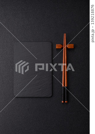 Empty slate board with wooden chopsticks for Asian food. Empty slate board 139218876