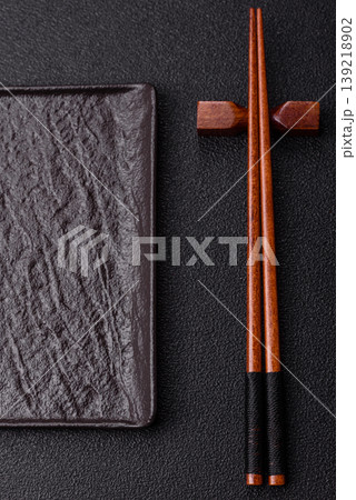Empty slate board with wooden chopsticks for Asian food. Empty slate board Empty slate board with wooden chopsticks for Asian food. Empty slate board 139218902