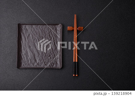 Empty slate board with wooden chopsticks for Asian food. Empty slate board 139218904