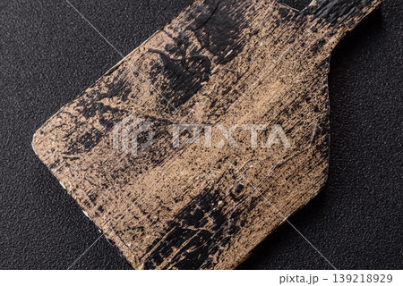 An empty wooden cutting board, kitchen utensils for food preparation. An empty cutting board 139218929