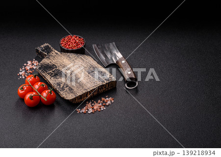 An empty wooden cutting board, kitchen utensils for food preparation. An empty cutting board An empty wooden cutting board, kitchen utensils for food preparation. An empty cutting board 139218934