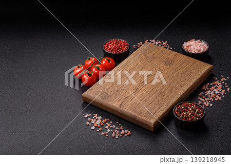 An empty wooden cutting board, kitchen utensils for food preparation. An empty cutting board 139218945