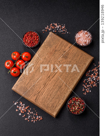 An empty wooden cutting board, kitchen utensils for food preparation. An empty cutting board 139218946