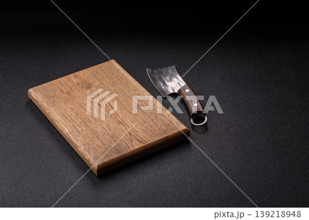 An empty wooden cutting board, kitchen utensils for food preparation. An empty cutting board 139218948