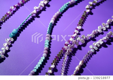 Color stones jewelry necklaces, purple background Color stones jewelry necklaces, purple background 139218977