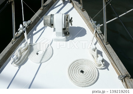 sailboat white bow with bollard and spiral rope sailboat white bow with bollard and spiral rope 139219201