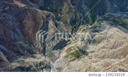 Mountain canyon with rocky cliffs and green forest 139219228