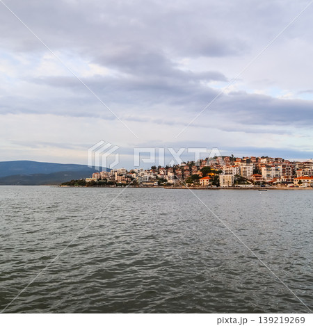 Gulluk town on Aegean Sea, Turkey, featuring seaside buildings and urban landscape across calm waters 139219269