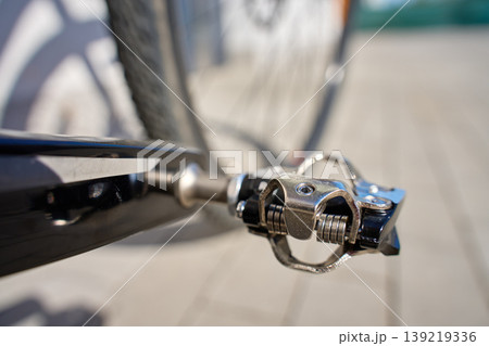 Close up of clipless bicycle pedal on bike crank arm 139219336