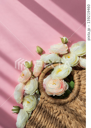 Straw Handbag with Ranunculus Flowers on Pink Background Straw Handbag with Ranunculus Flowers on Pink Background 139219460