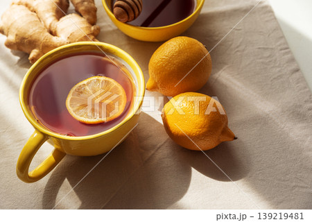 Flat Lay with Lemon Tea, Ginger and Honey on Light Table Flat Lay with Lemon Tea, Ginger and Honey on Light Table 139219481