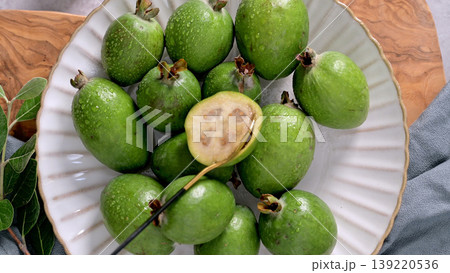 Fresh Feijoa Fruit on a Plate, Close-up View Fresh Feijoa Fruit on a Plate, Close-up View 139220536