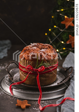 Traditional Panettone with Red Velvet Ribbon and Decor 139220678