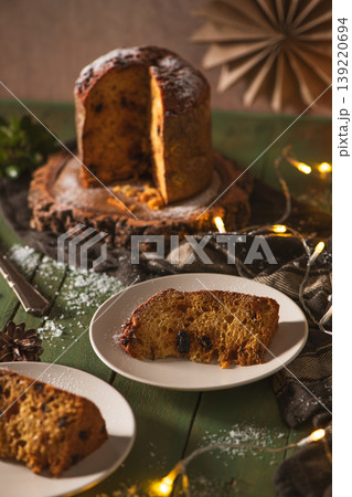 Two Slices of Panettone on Plates Against a Moody Background 139220694