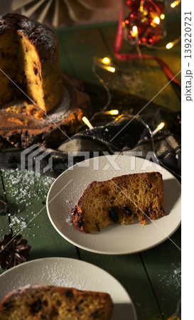 Traditional Panettone Slices and Loaf with Holiday Lights 139220721