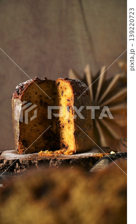 Vertical Close-up of Sliced Traditional Italian Panettone Christmas Bread on a Rustic Wooden Block Vertical Close-up of Sliced Traditional Italian Panettone Christmas Bread on a Rustic Wooden Block 139220723