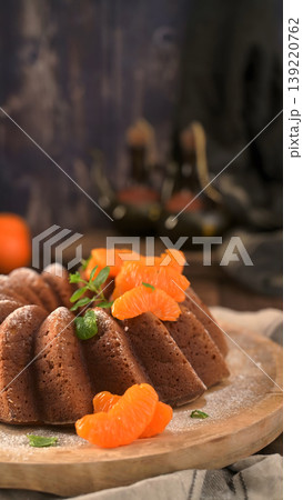 Orange Citrus Bundt Cake with Fresh Tangerine Slices and Mint Orange Citrus Bundt Cake with Fresh Tangerine Slices and Mint 139220762