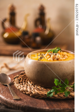 Creamy Chickpea Soup with Black Sesame Seeds and Fresh Herbs in a Rustic Bowl Creamy Chickpea Soup with Black Sesame Seeds and Fresh Herbs in a Rustic Bowl 139220779