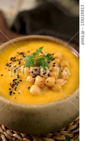 Creamy Butternut Squash Soup Topped with Roasted Chickpeas and Black Sesame Seeds Creamy Butternut Squash Soup Topped with Roasted Chickpeas and Black Sesame Seeds 139220813