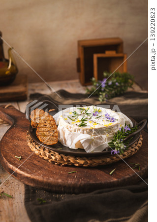 Baked Camembert Cheese with Rosemary and Toasted Bread Slices Baked Camembert Cheese with Rosemary and Toasted Bread Slices 139220823