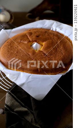 Golden Brown Bundt Cake Cooling on Parchment Paper Golden Brown Bundt Cake Cooling on Parchment Paper 139220921